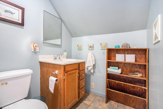 half bathroom with toilet, vanity, baseboards, and vaulted ceiling