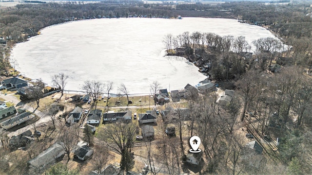 aerial view featuring a wooded view