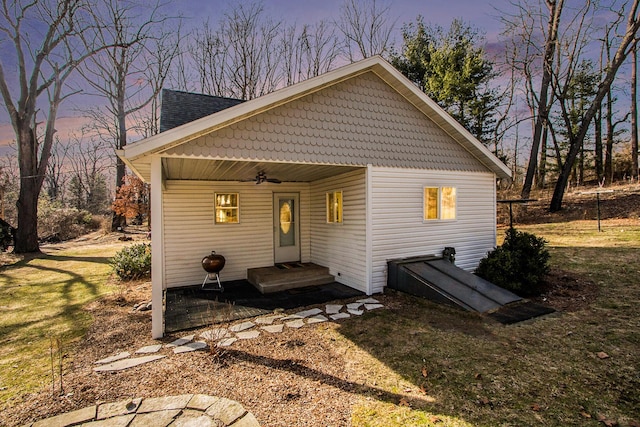 back of house with a ceiling fan