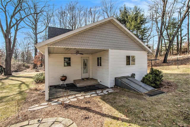 back of property featuring ceiling fan