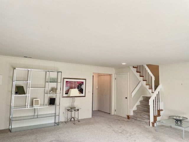 interior space featuring stairway and carpet flooring