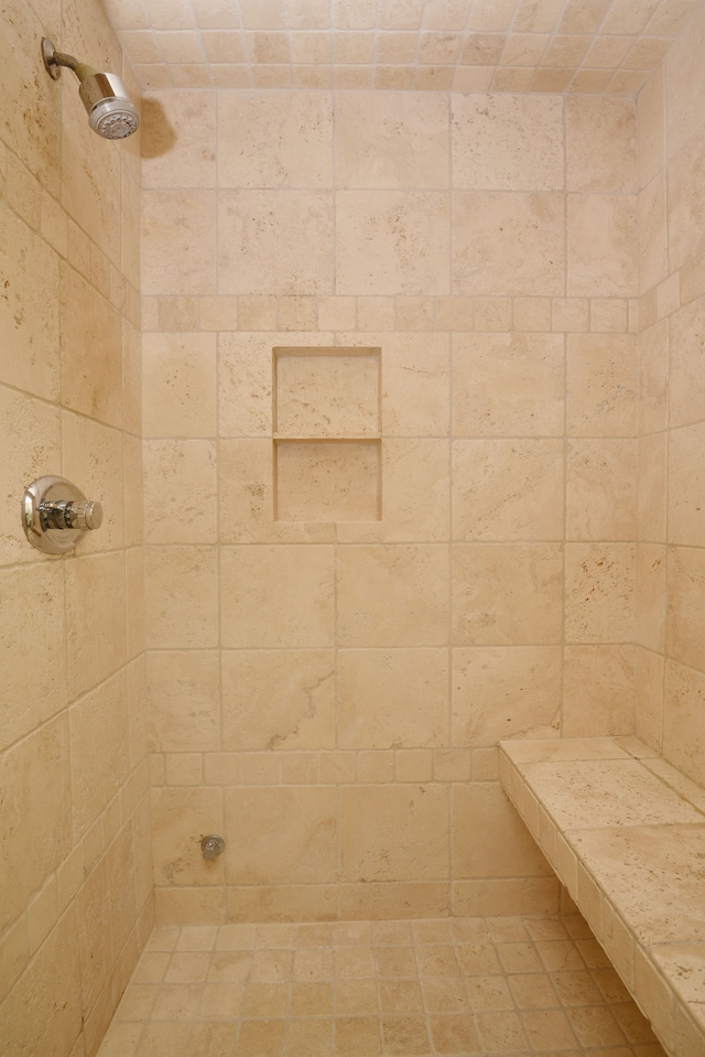 bathroom with a tile shower