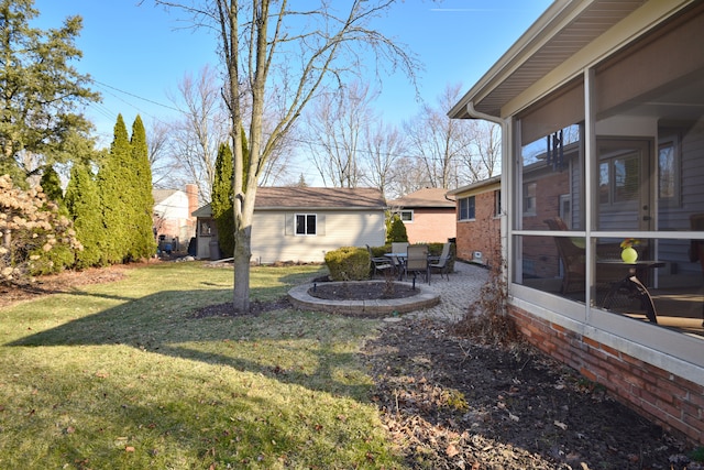 view of yard with a patio area and a sunroom