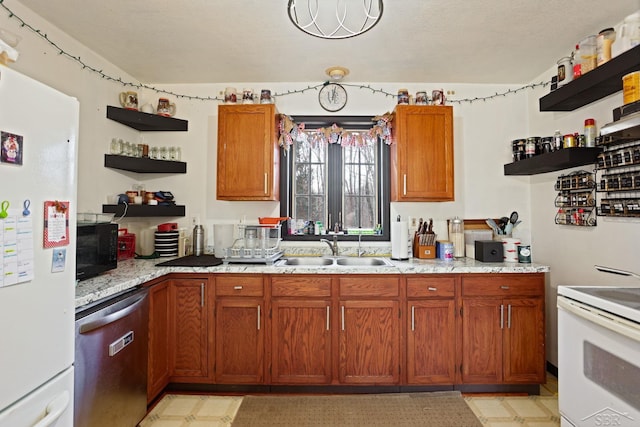 kitchen featuring open shelves, white appliances, light floors, and a sink