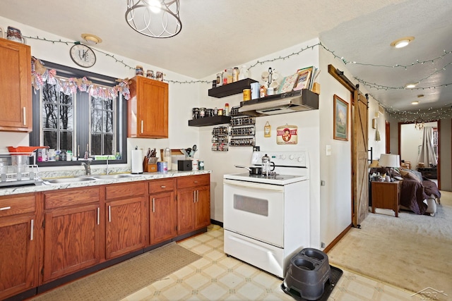 kitchen with under cabinet range hood, light floors, white electric range oven, and a sink