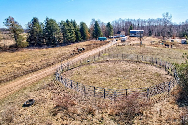 birds eye view of property featuring a rural view