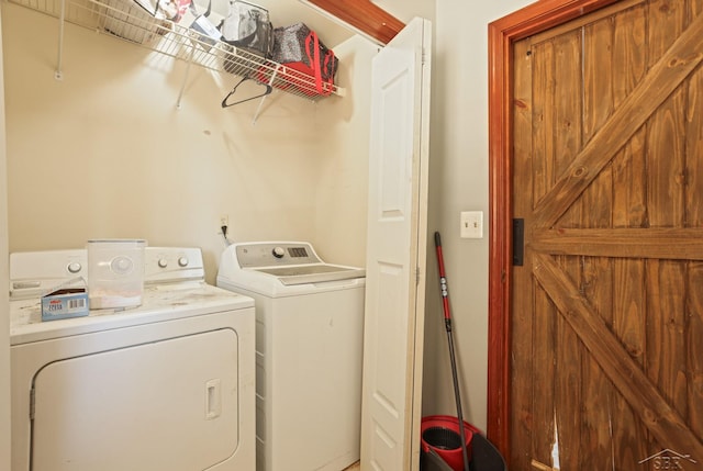 laundry area with independent washer and dryer and laundry area