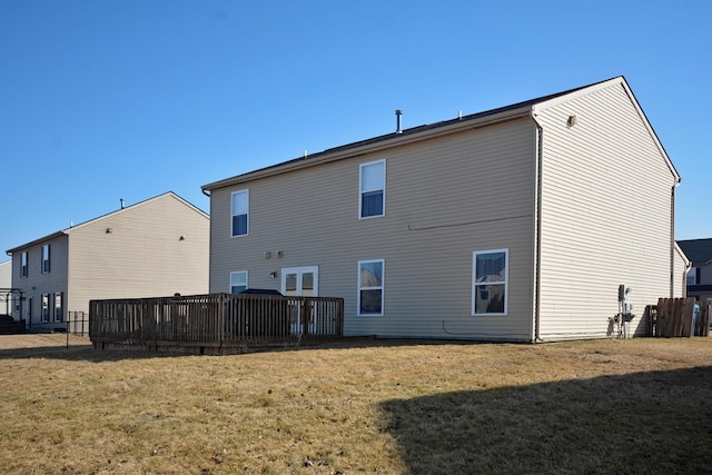 back of house with a lawn