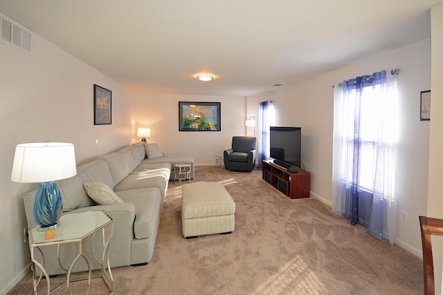 living area featuring carpet floors and baseboards