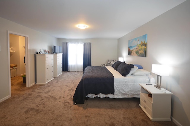 bedroom with carpet and baseboards