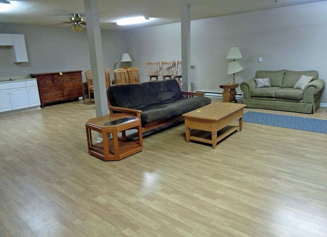 living room featuring light wood-style floors and ceiling fan