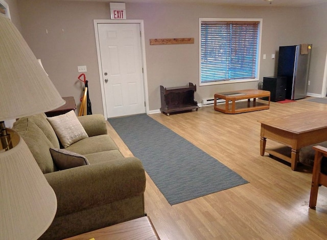 living room with baseboards and wood finished floors