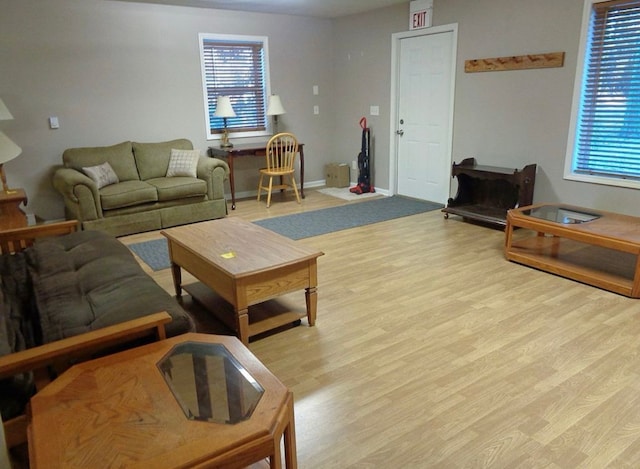 living area with wood finished floors and baseboards