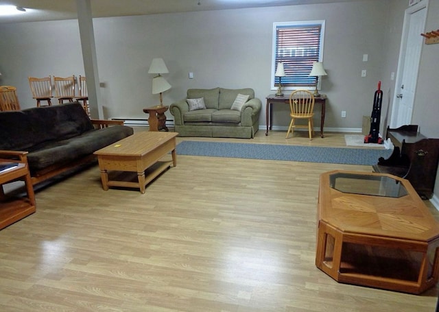 living area featuring light wood-type flooring and baseboards