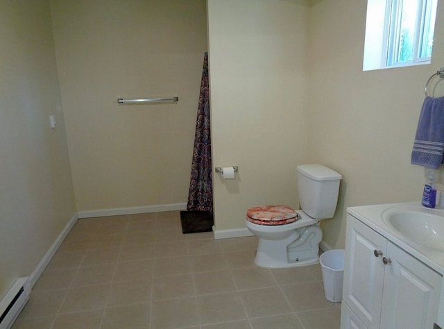 bathroom with tile patterned floors, toilet, baseboards, baseboard heating, and vanity