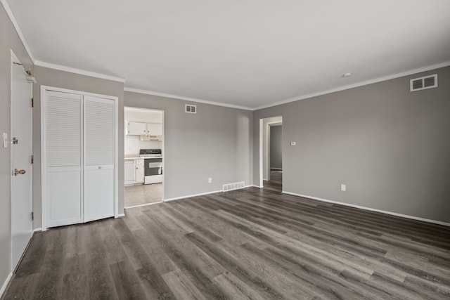 unfurnished living room with visible vents, baseboards, and dark wood-style floors