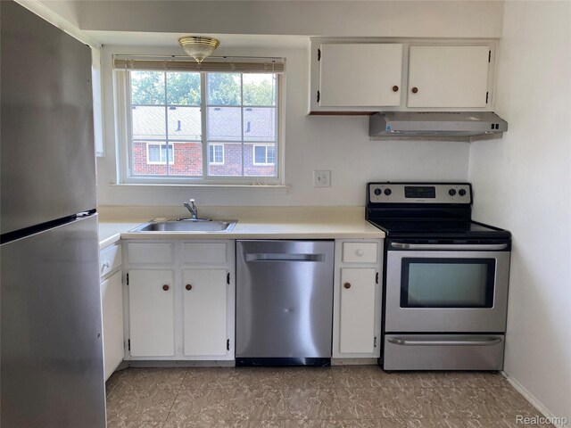 25331 Shiawassee Cir Unit 206, Southfield, MI 48033 - kitchen featuring appliances with stainless steel finishes, range hood, a sink, and light countertops