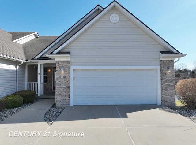 ranch-style house with concrete driveway, an attached garage, brick siding, and covered porch