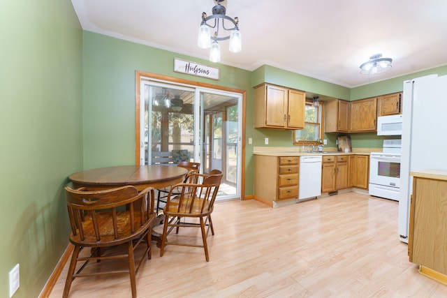 kitchen featuring white appliances, light countertops, light wood-type flooring, and baseboards