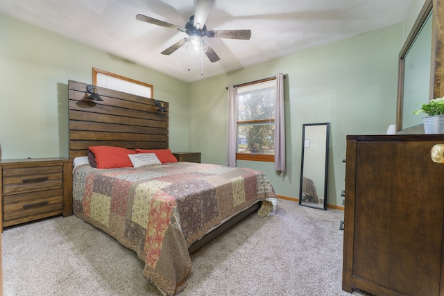 bedroom with baseboards, carpet, and ceiling fan