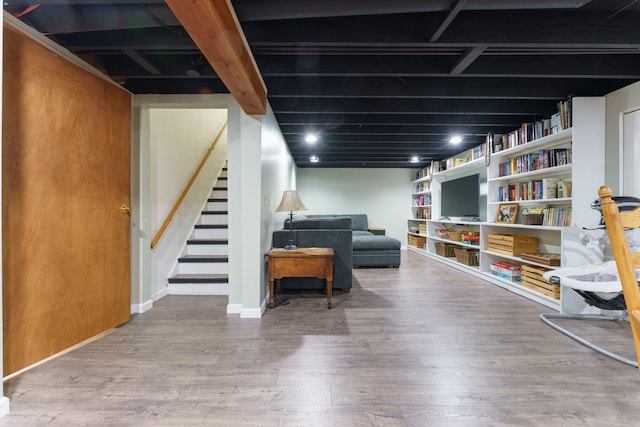 interior space featuring stairway and wood finished floors