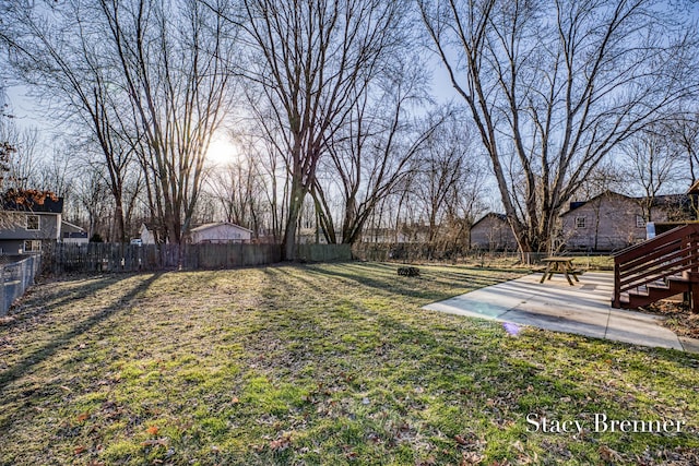 view of yard featuring a patio area and a fenced backyard