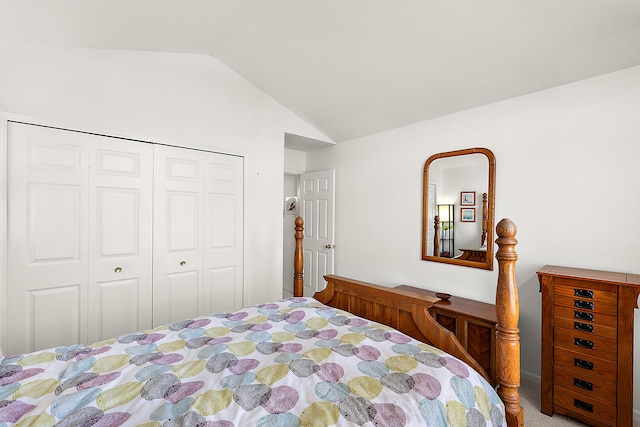 carpeted bedroom with lofted ceiling and a closet