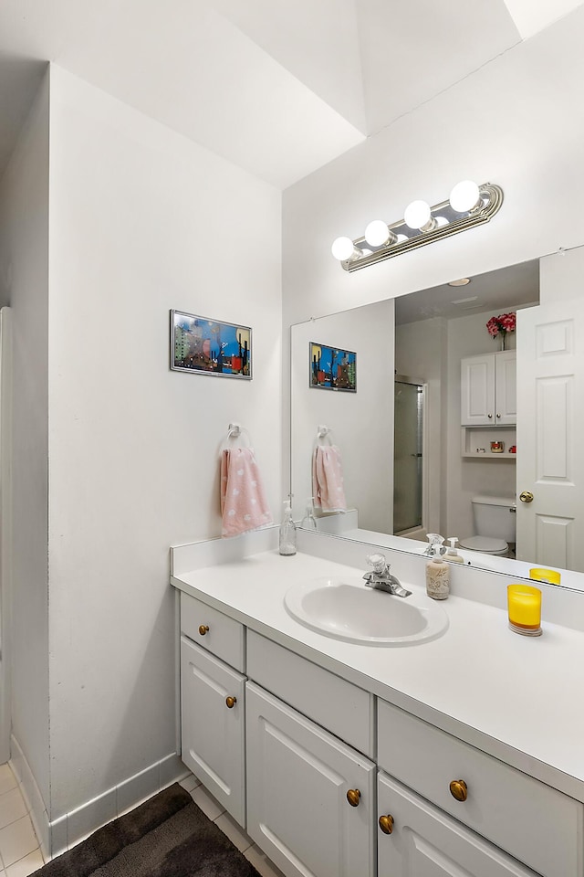 full bath with tile patterned flooring, baseboards, toilet, an enclosed shower, and vanity