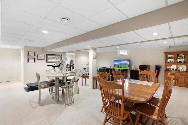 dining space featuring recessed lighting and light colored carpet