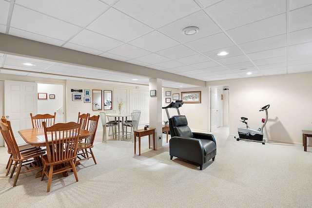 dining room with recessed lighting, a paneled ceiling, and light carpet