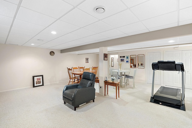 sitting room with recessed lighting, carpet, baseboards, and a drop ceiling