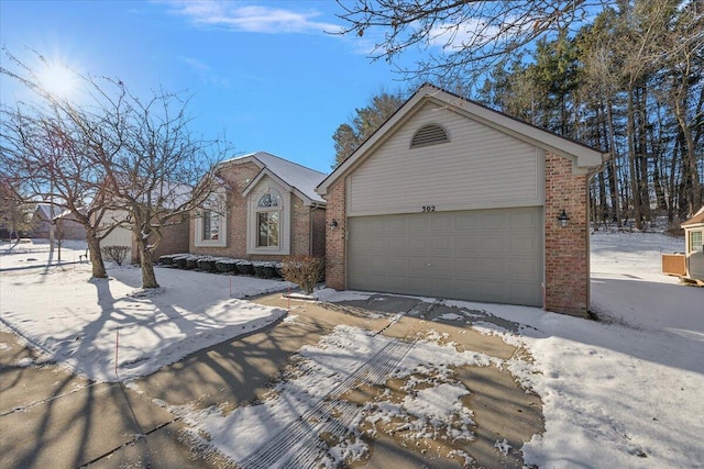 view of front facade featuring brick siding and an attached garage