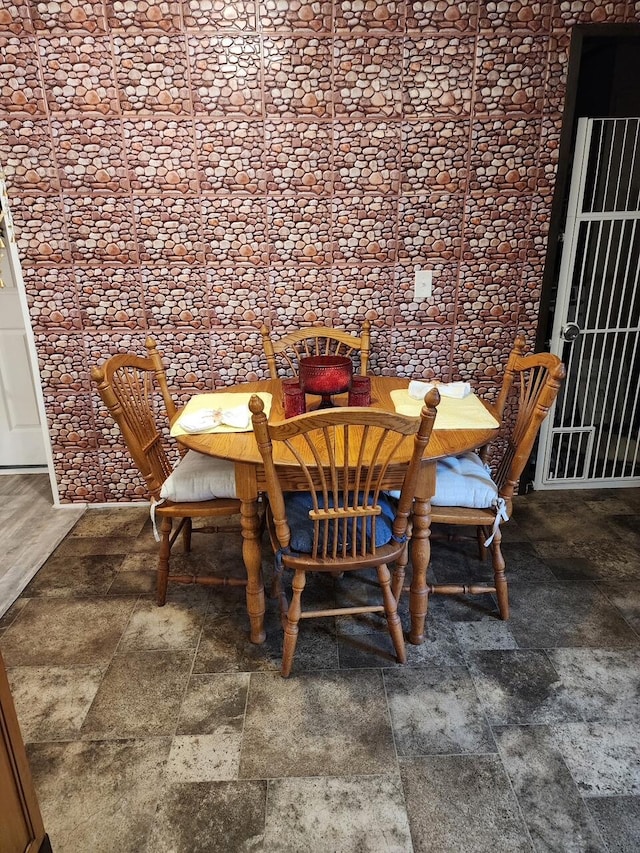 dining room featuring stone finish floor