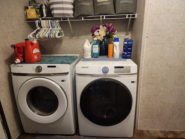 laundry room with laundry area and washing machine and dryer