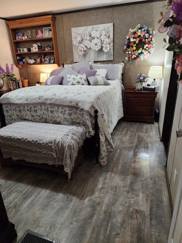 bedroom featuring wood finished floors