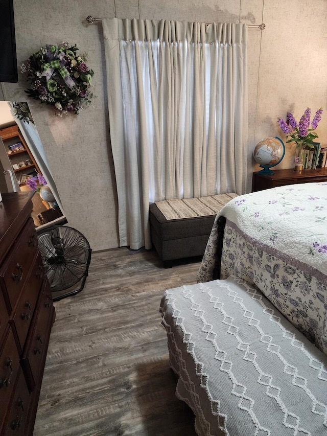 bedroom featuring wood finished floors