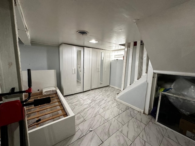 kitchen with visible vents, marble finish floor, and baseboards