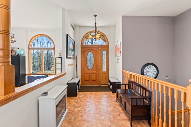 foyer entrance with visible vents