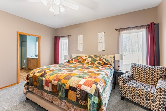 bedroom featuring connected bathroom, baseboards, a ceiling fan, and carpet flooring