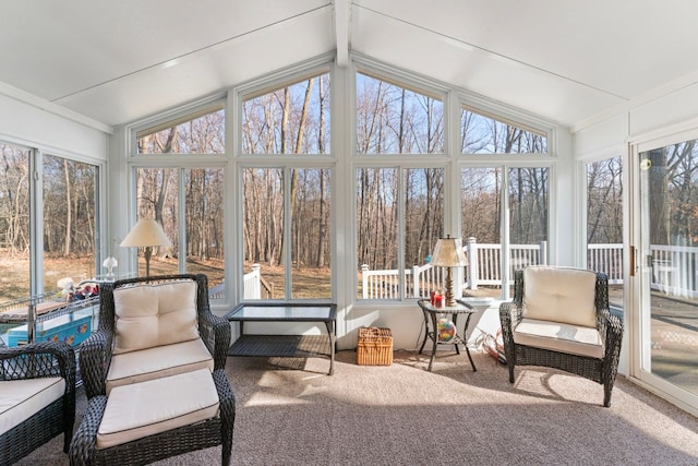 sunroom with lofted ceiling with beams