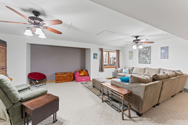 living area with baseboards, carpet, and a ceiling fan