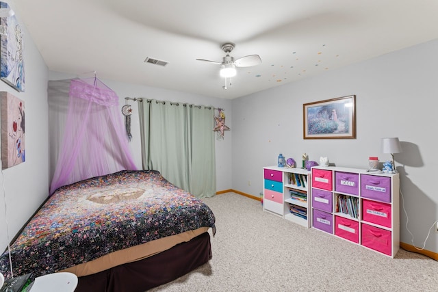 bedroom featuring visible vents, a ceiling fan, baseboards, and carpet floors