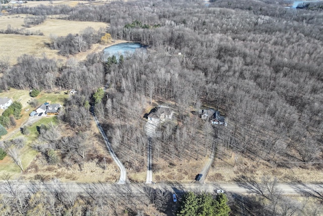 aerial view featuring a view of trees and a water view