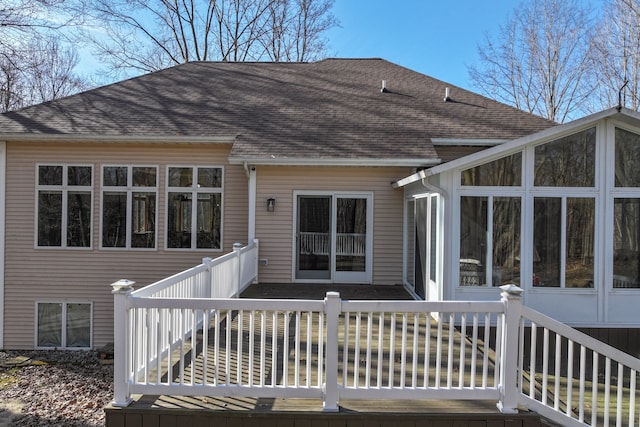 wooden terrace featuring a sunroom