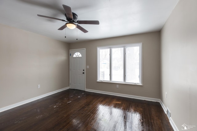 entrance foyer featuring visible vents, a ceiling fan, baseboards, and hardwood / wood-style flooring