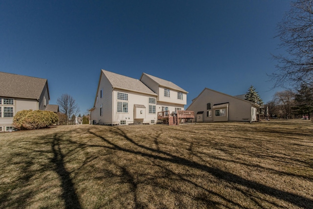 back of property featuring a lawn