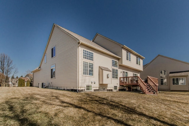 back of property featuring cooling unit, a lawn, and a deck