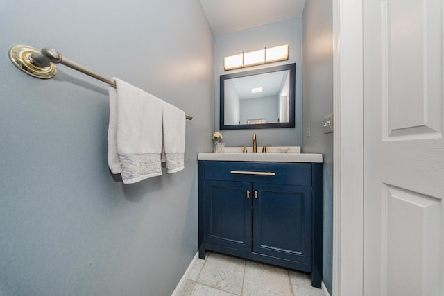 bathroom with vanity and baseboards