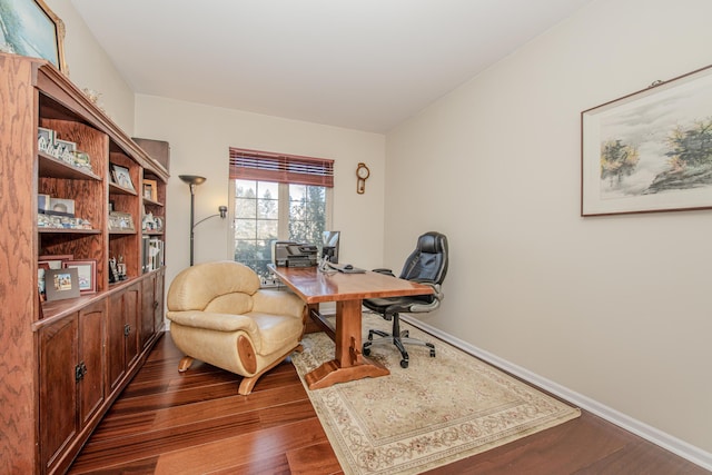 office with baseboards and dark wood-type flooring