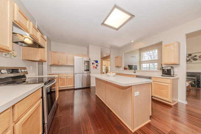 kitchen featuring light brown cabinetry, a center island, smart refrigerator, and stainless steel electric range oven